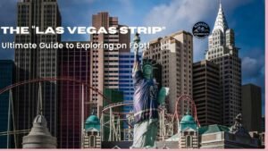 "Statue of Liberty replica in front of New York-New York Hotel on the Las Vegas Strip with skyscraper facades and roller coaster track"